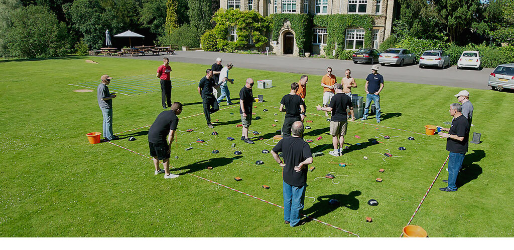 Corporate Game Show - People playing minefield on the grass
