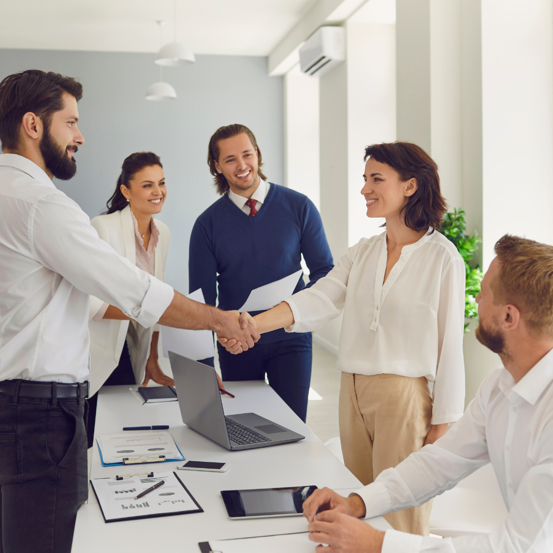 Onboarding New Hires. Friendly Businesspeople Shaking Hands