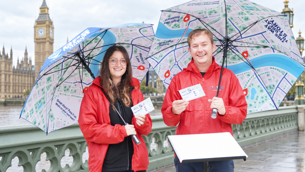 Race Around staff carrying umbrellas